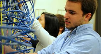 Photo of student working with wires